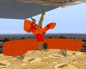 Iyoba does a handstand by the 'ouch couch'
