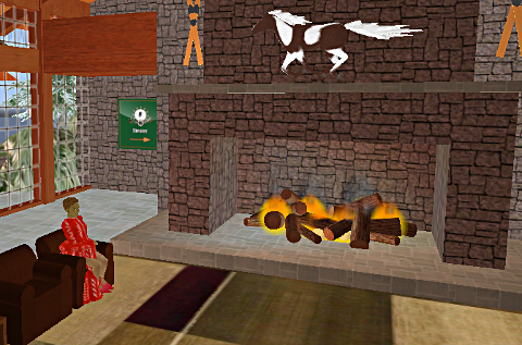 Iyoba sits before a blazing fire