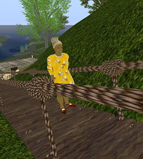 Iyoba climbs to the dig at the top of the hill